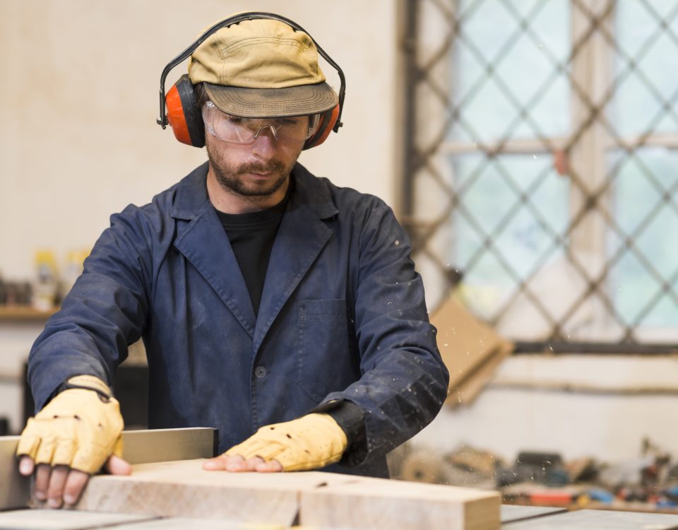 male-carpenter-placing-wooden-blocks-workshop